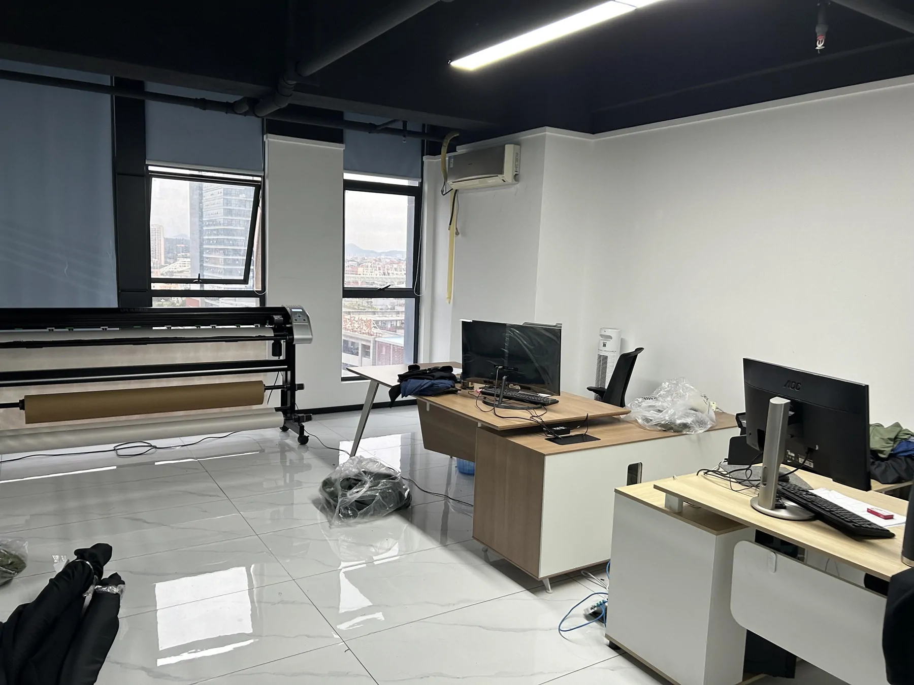 Our factory preparation room with a large-format plotter and computer workstations