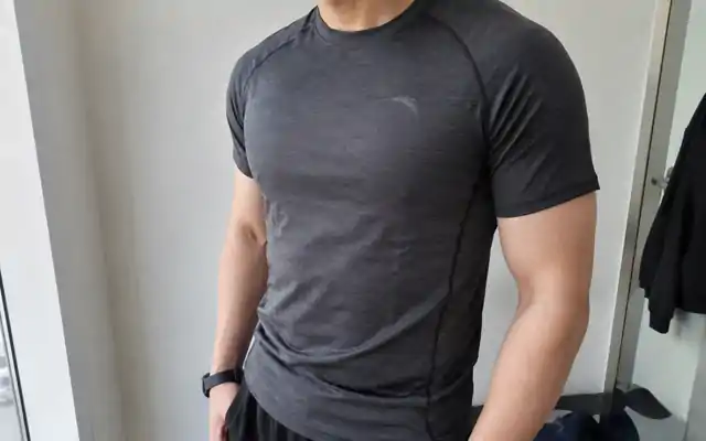 Close view of seams and fit on a men's compression top
