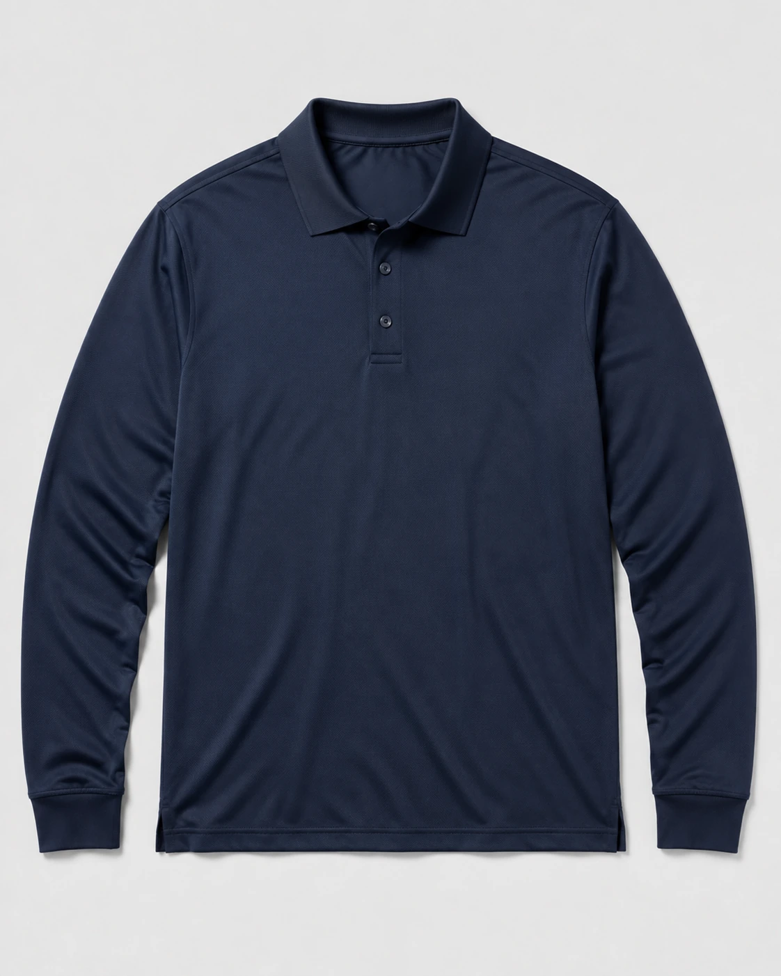 Navy performance long-sleeve polos on a neutral studio background