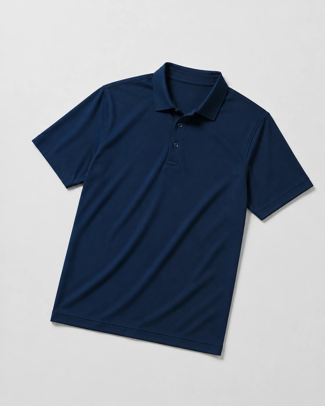 Short-sleeve performance polo with a structured collar and button placket on a neutral studio background