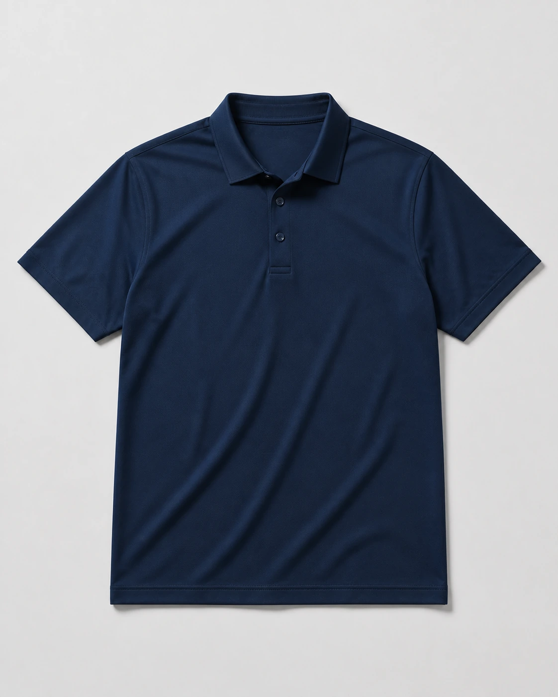 Navy performance short-sleeve polos on a neutral studio background