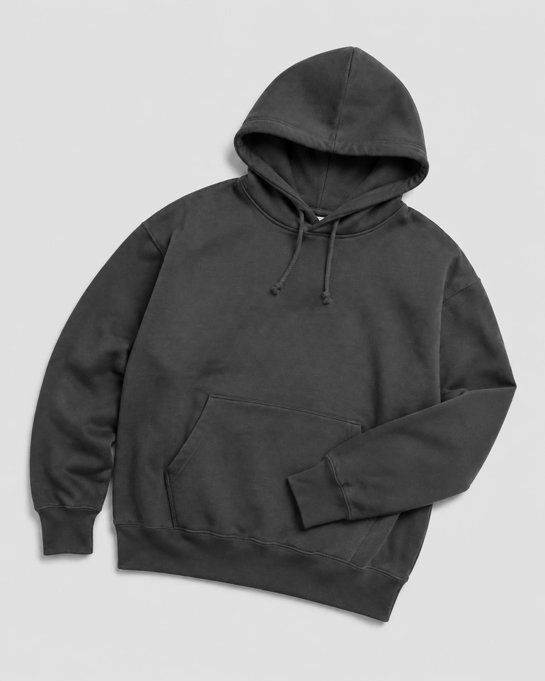 Charcoal pullover hoodie arranged on a light-grey studio background, showing its hood and ribbed cuffs