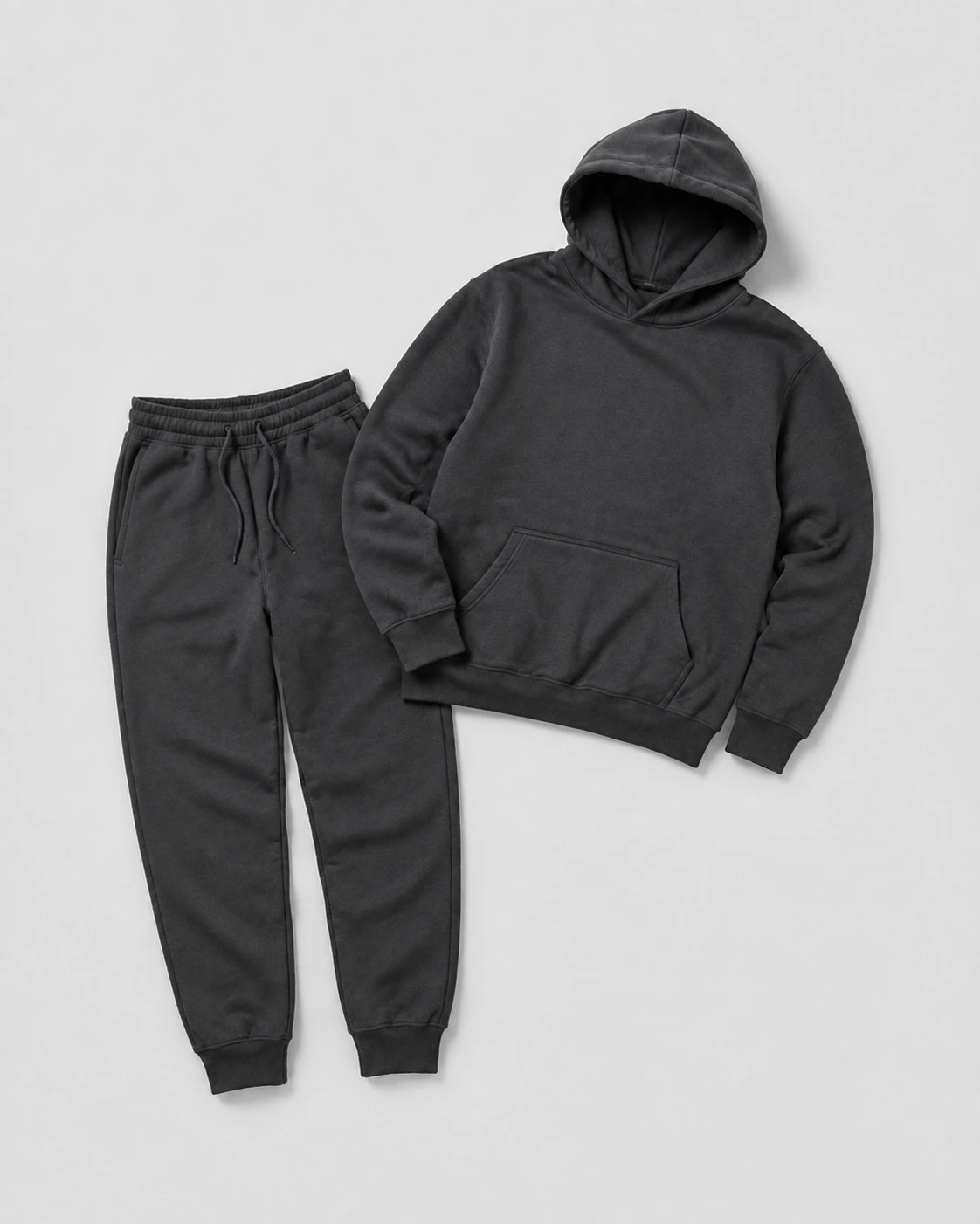 Coordinated pullover hoodie and matching fleece joggers arranged as a two-piece set