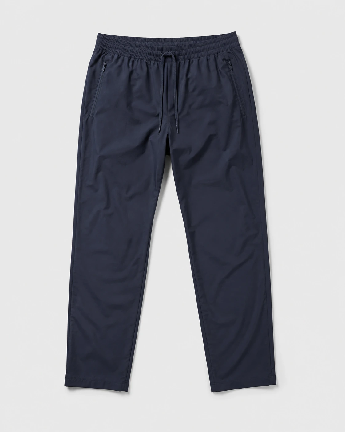 Navy performance pants on a neutral studio background