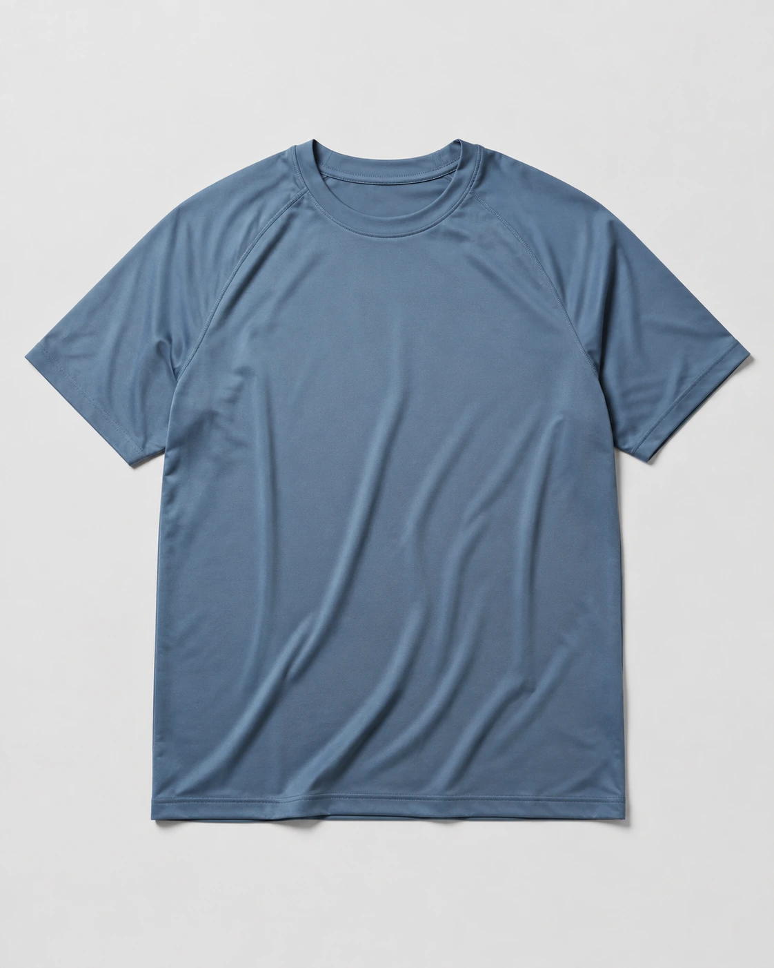 Slate Blue performance tees on a neutral studio background