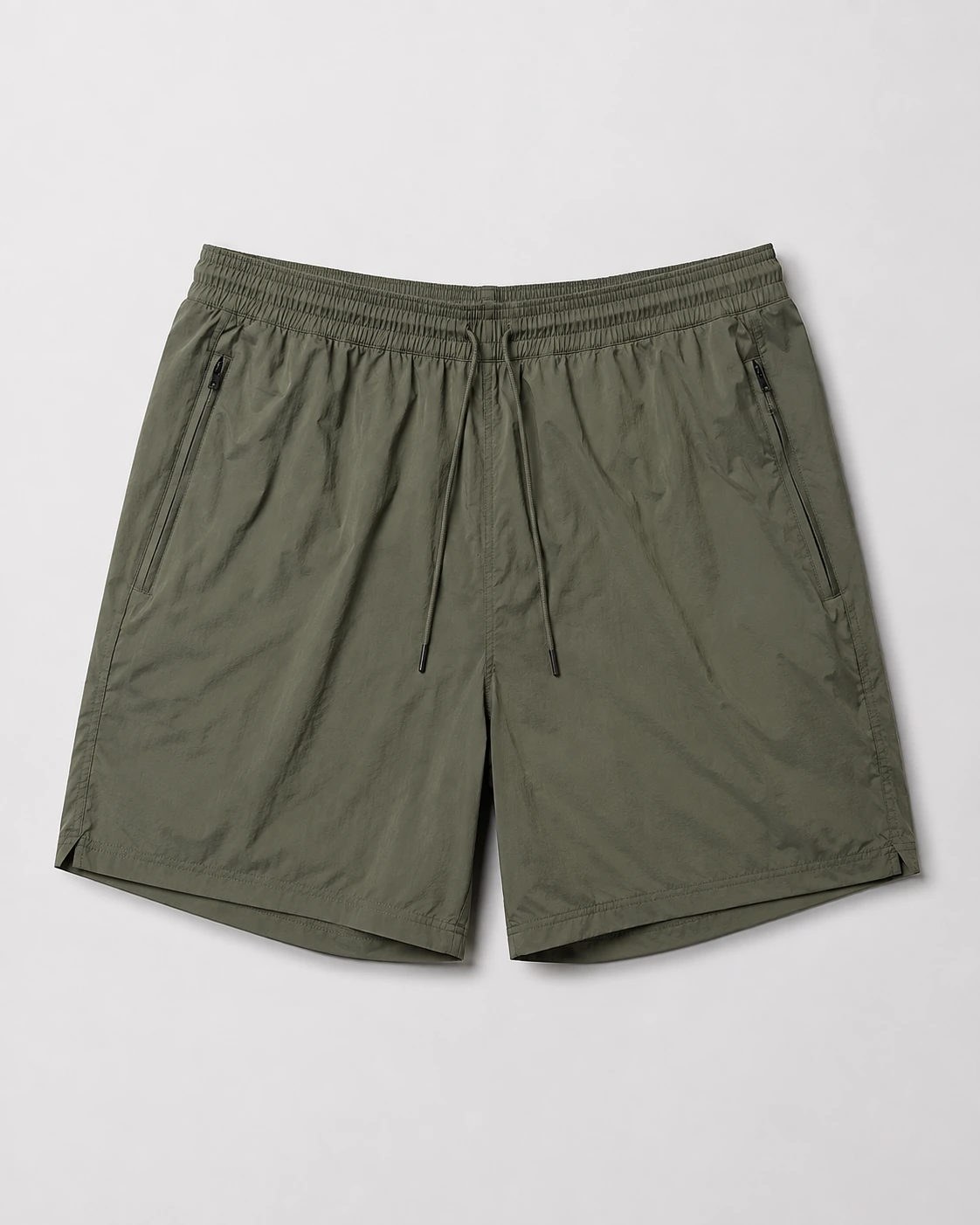 Olive training shorts on a neutral studio background